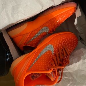 Nike Kids Orange Sneakers with Silver Accents